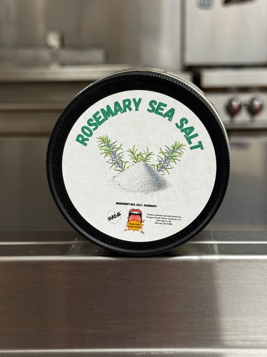 Container of rosemary sea salt on a metallic surface
