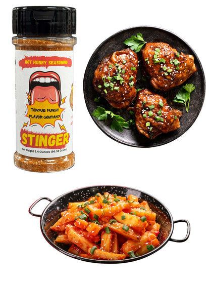 Hot honey seasoning bottle with two dishes of food on a white background